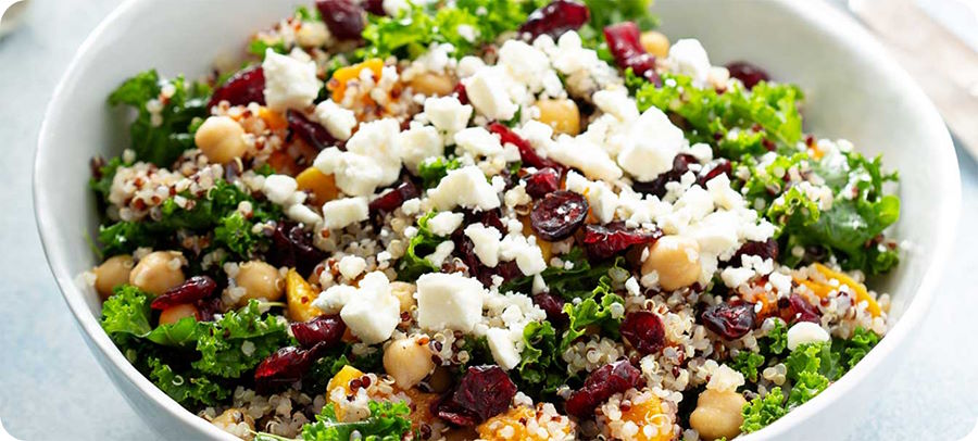 quinoa salad with kale, cranberries, goat cheese, chickpeas.