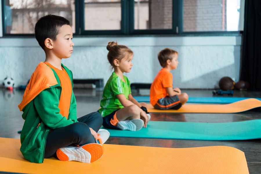 Young children doing yoga