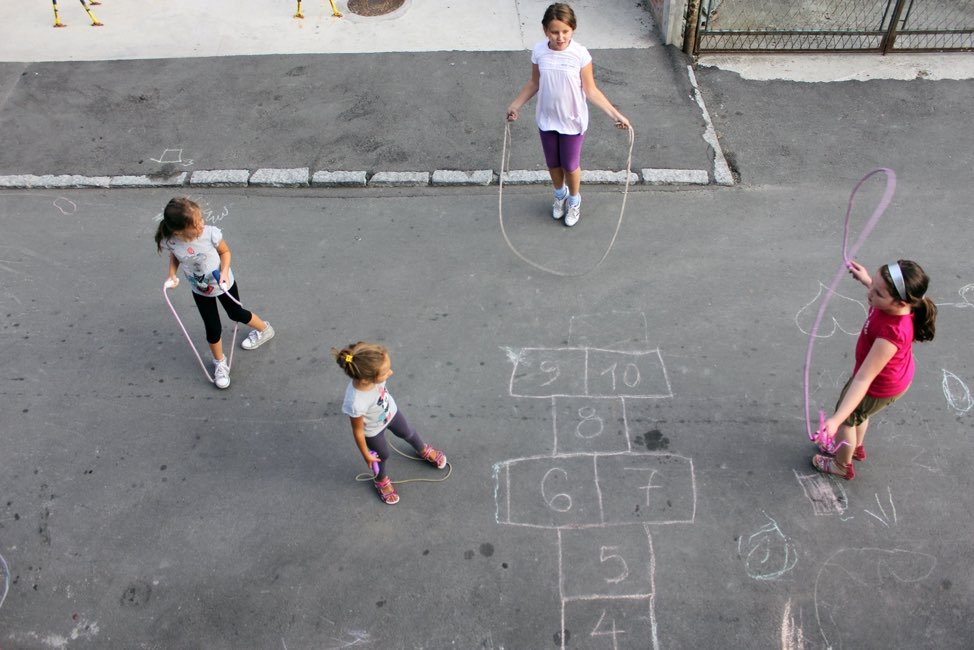 Four girls outside skipping rope